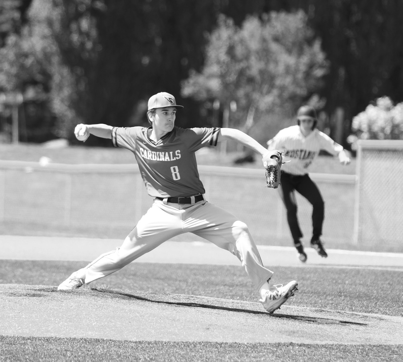 Eastyn Schaefer eyes the batter and delivers a strike. Photo by Chelsea Wysocki/The Walsh County Record.