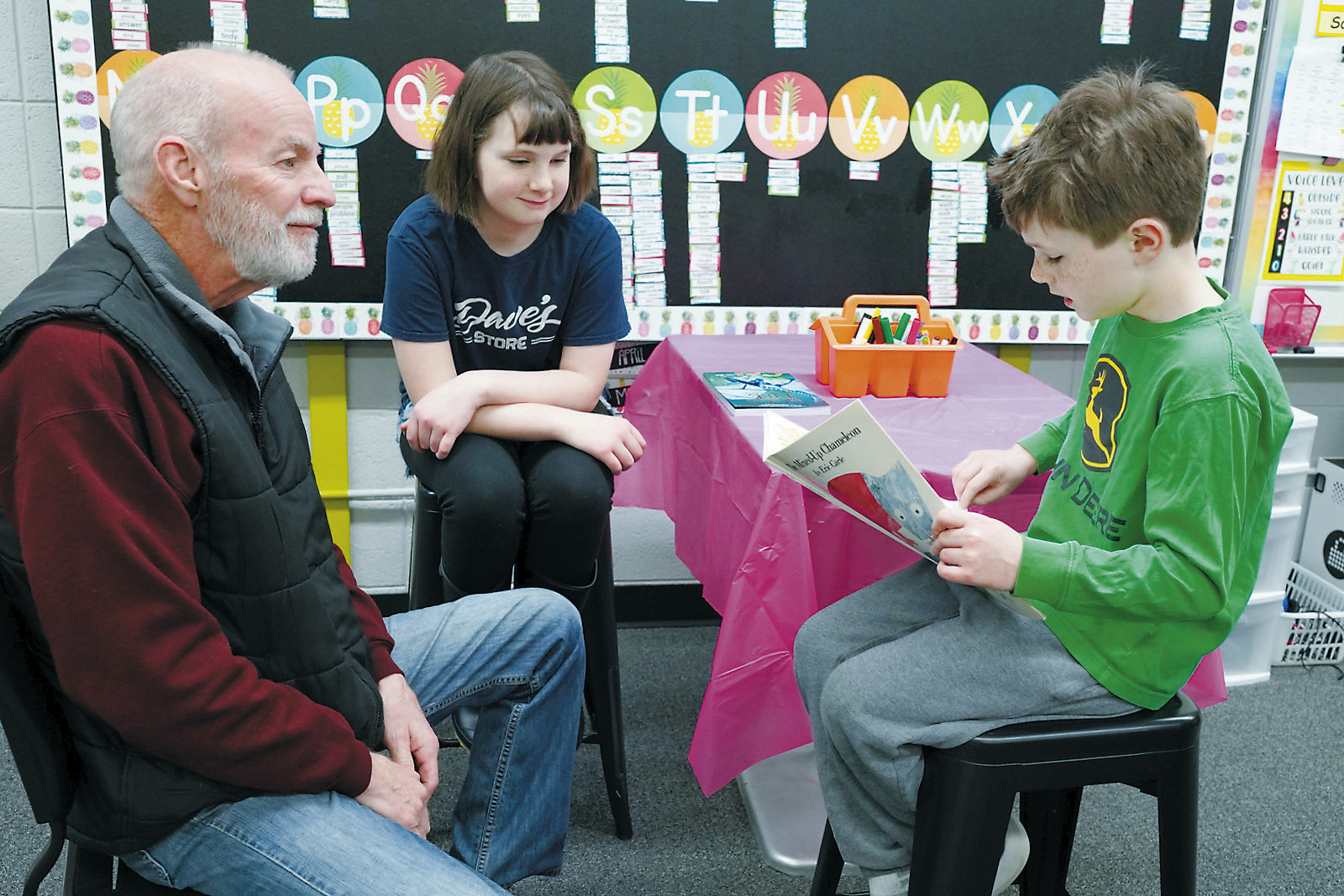 The Borderland Press's very own photographer had a chance to participate in National Reading Month with Callen and Elin Hinnenkamp reading to him at St. Alphonsus School last week.