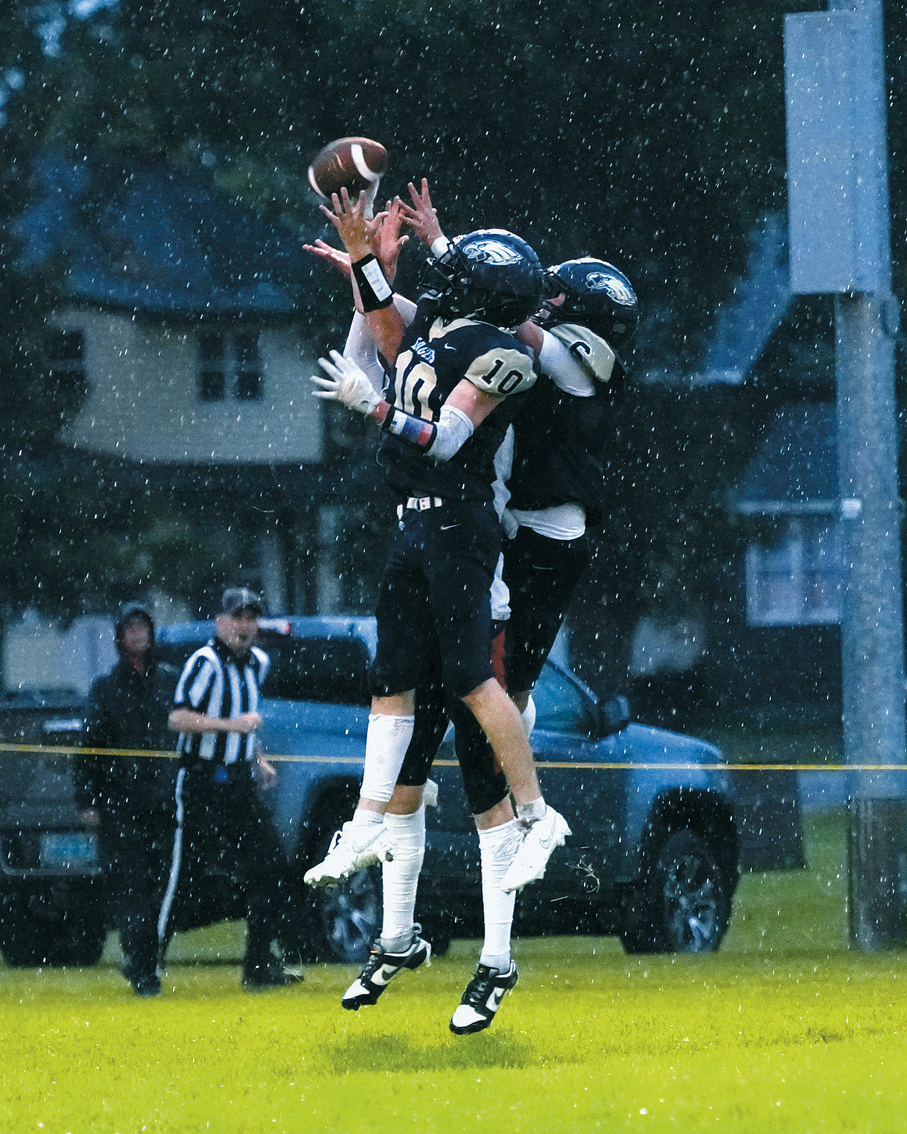 Kaden Moore and Grant Cosley break up a pass against the North Star Bearcats. Photo by Larry Stokke.
