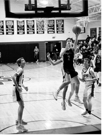 After a steal, Kaden Moore converts on the other end for a layup. Photo by Ashley Schafer