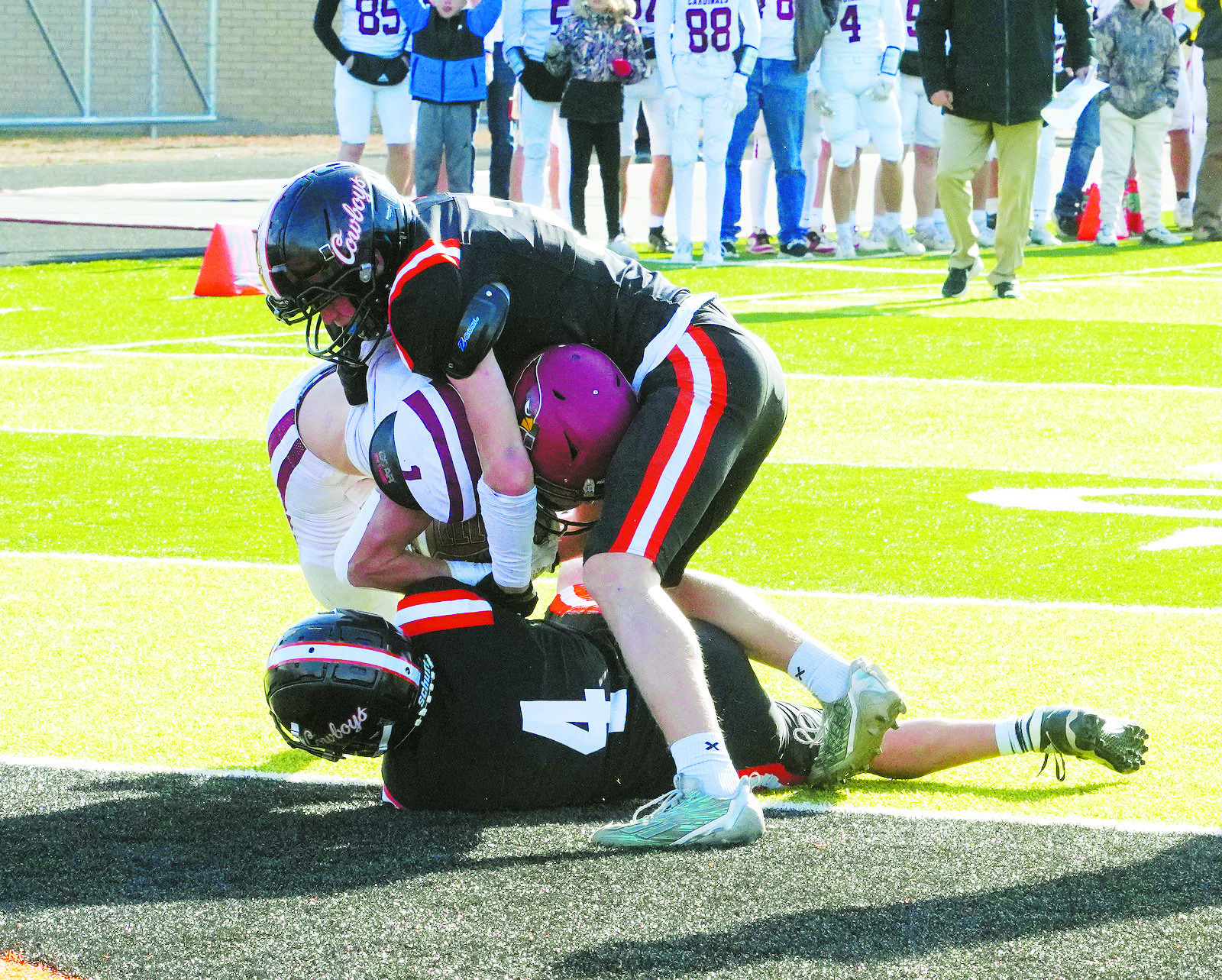 Jayden Lee scores on a 4-yard run with Jax Johnson adding the extra point to tie the score with Killdeer at 7. Photo by Larry Stokke.