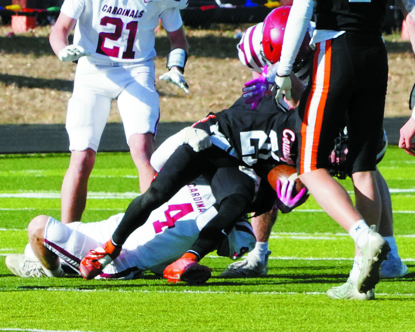 Sam Davis tackles a Killdeer ball carrier, stopping their run. Photo by Larry Stokke.