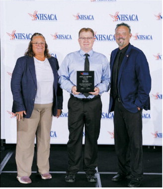 Rich Olson, center, was recognized as a National High School Athletic Coaches Association (NHSACA) Volleyball Coach of the Year finalist during the organization’s national awards presentation. Olson is pictured with NHSACA Volleyball Sports Chair Jean LaClair, left, and NHSACA President Scott Jarvis. Photo submitted
