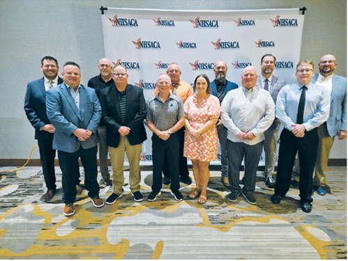 North Dakota coaches recognized at the NHSACA National Awards banquet pose for a group photo during the 2026 conference. Pictured are the state’s finalists and award recipients, including Benson County track and field coach Bobby Hoffner, who was the only North Dakota coach to earn National Coach of the Year honors this year. Photo submitted
