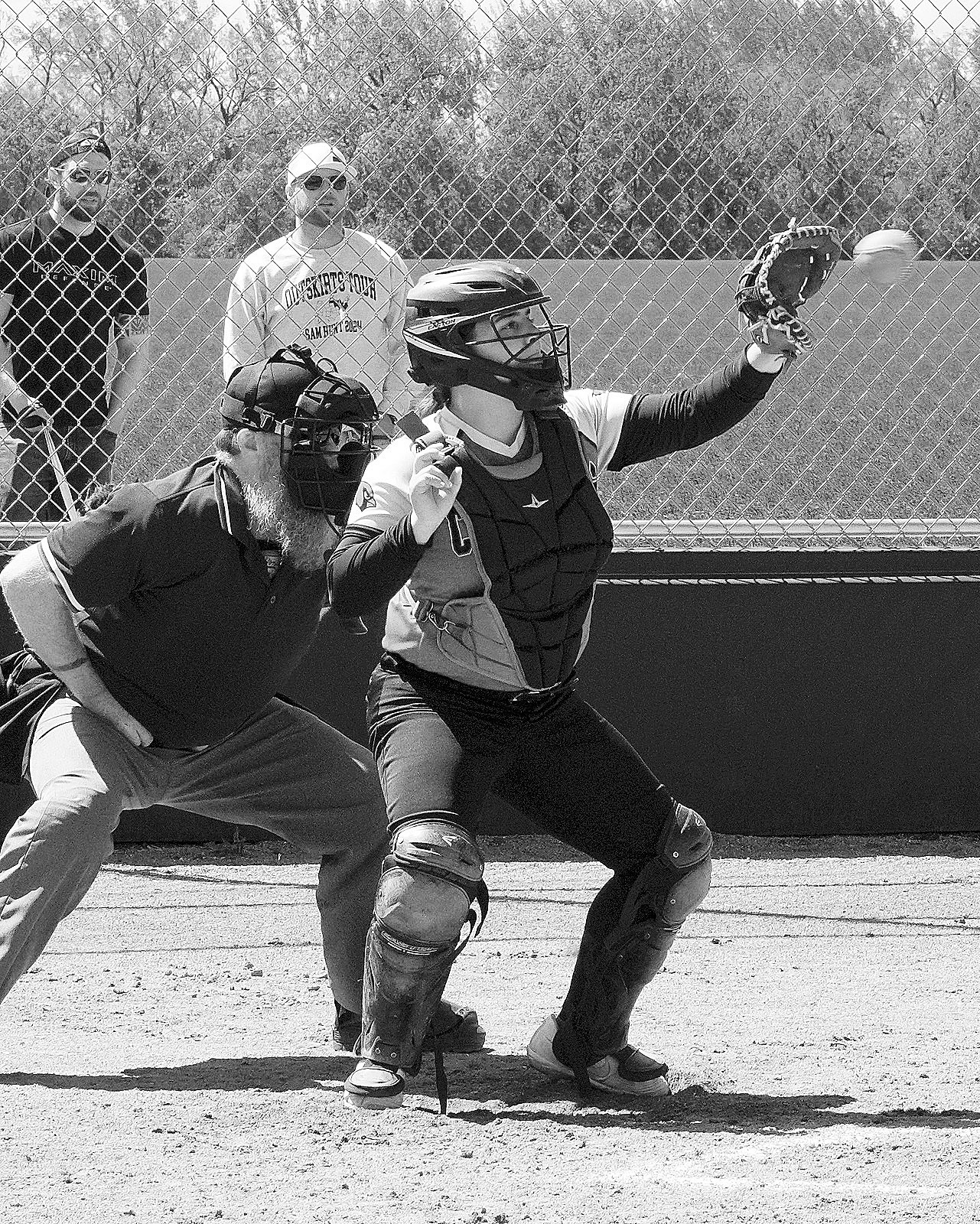 Kenadee Cluchie with a catch behind the plate against Thompson. Photo by Larry Stokke.