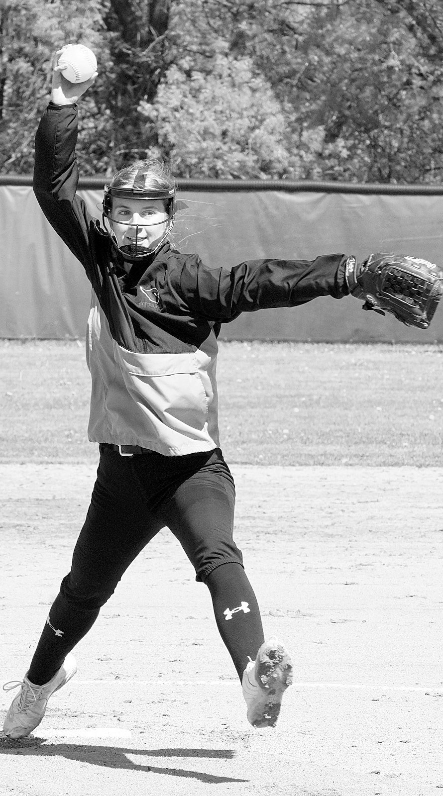 Tallie Johnston winds up to send a strike across the plate in Thompson on May 18 against the Tommies. Photo by Larry Stokke.