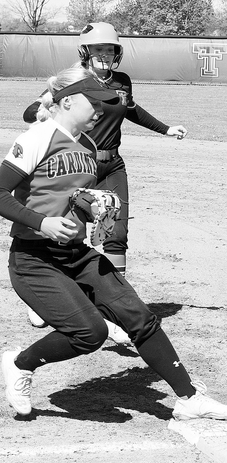McKenna Schneider puts a Thompson player out at first base. Photo by Larry Stokke.