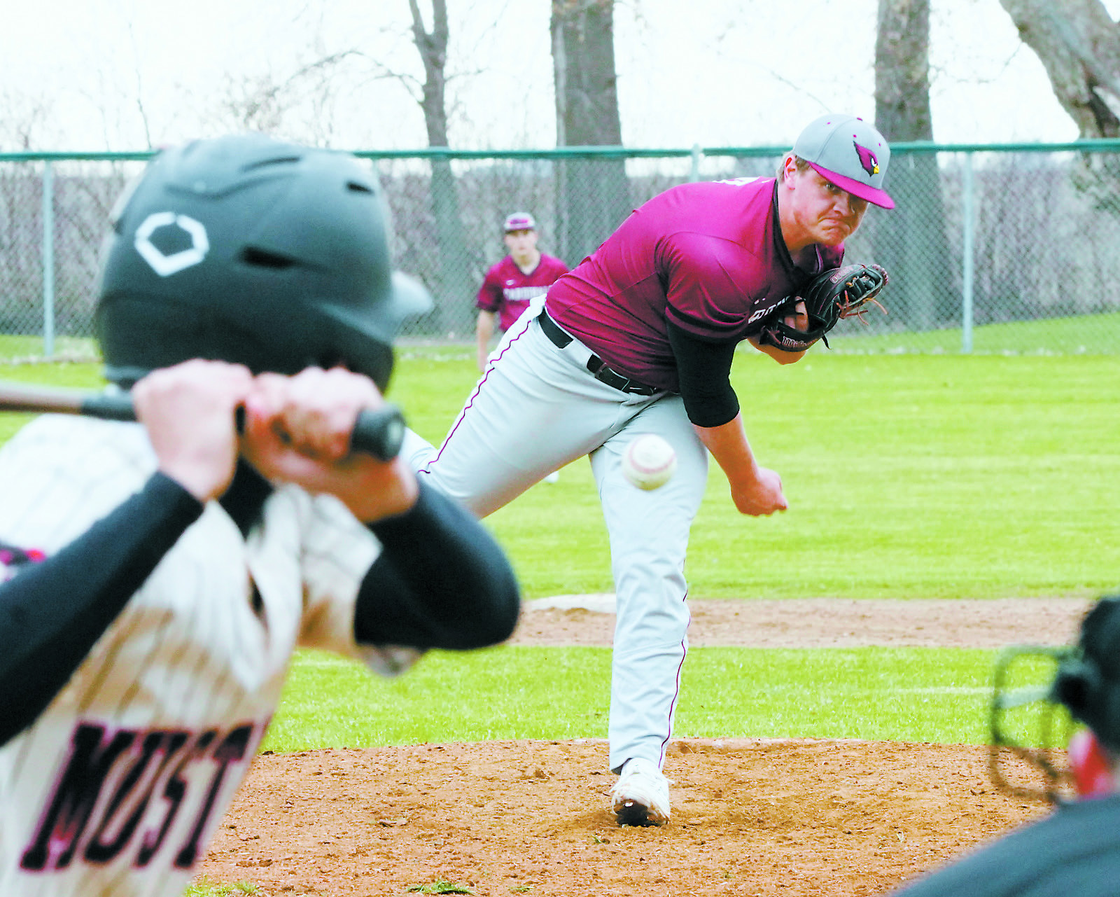 Theo Romfo throws a strike in the Cards' win over Midway/Minto. Photo by Larry Stokke.