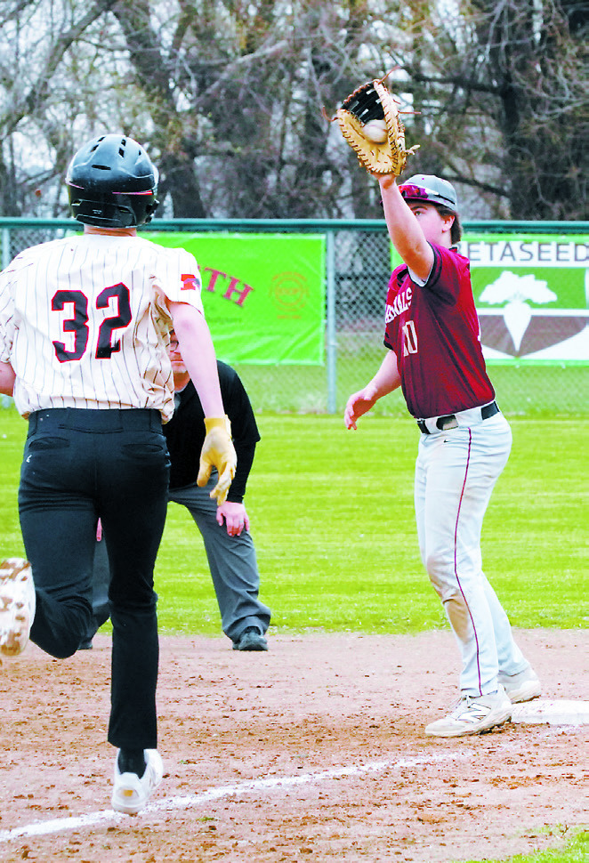Devin Hakanson with a catch that puts out a Mustang at first base. Photo by Larry Stokke.