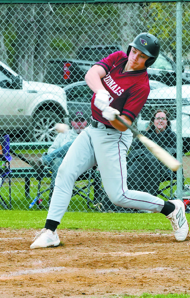 Landon Schneider drives the ball into the outfield for a base hit. Photo by Larry Stokke.