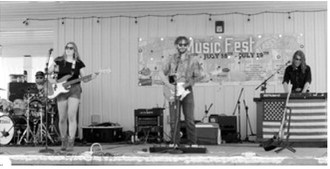 Auto Drive was among the many musical acts that kept crowds entertained throughout Rendezvous Region Music Fest in Langdon. The Starkweather-based band is wrapping up its final summer tour together. Photo by Larry Stokke