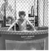 A young participant takes the plunge in the dunk tank during Rendezvous Region Music Fest. Photo by Larry Stokke