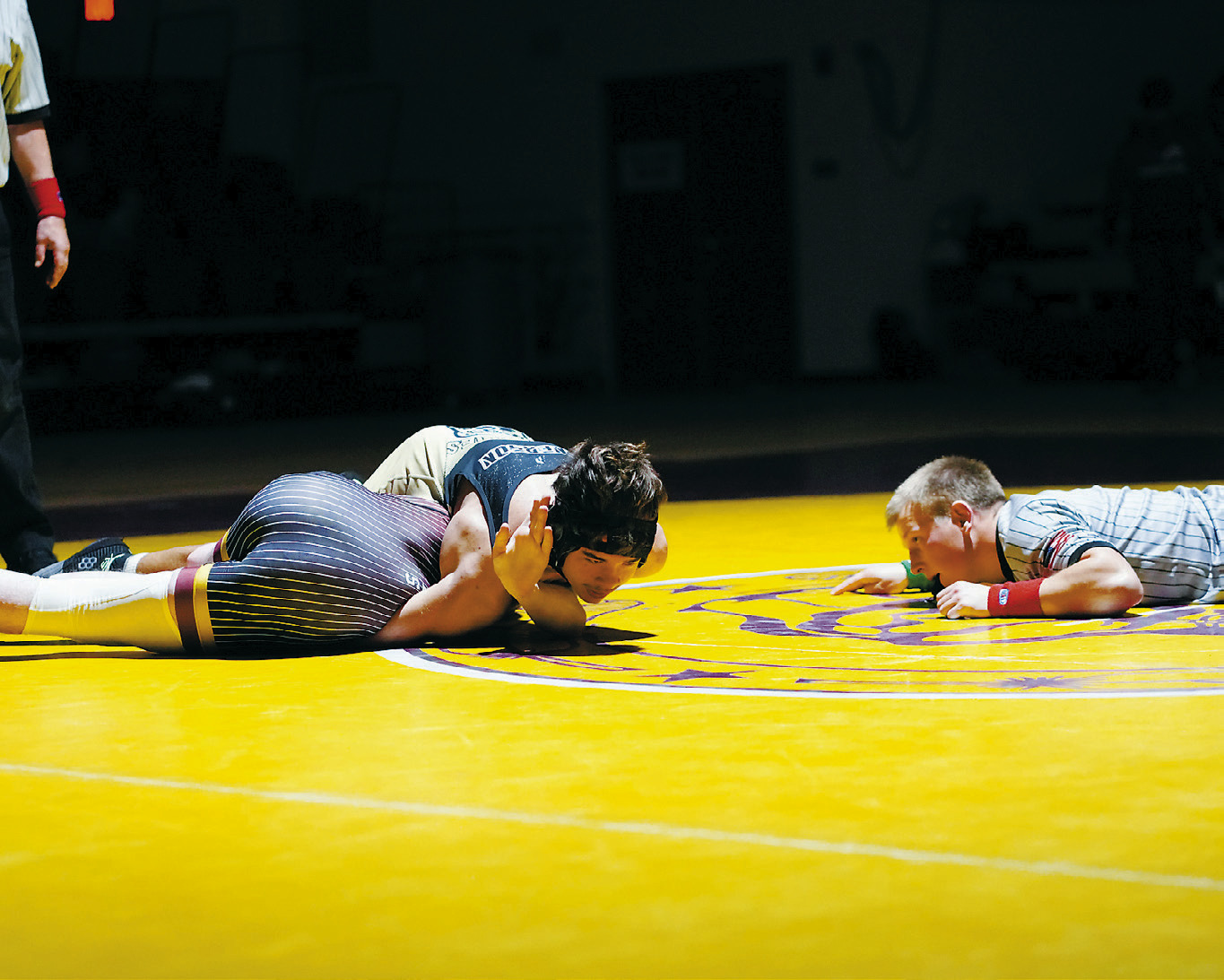 Abel Emerson pinned his Watford City opponent to win his 145 pound weight class in Belcourt on Dec. 4. Photo by Larry Stokke.