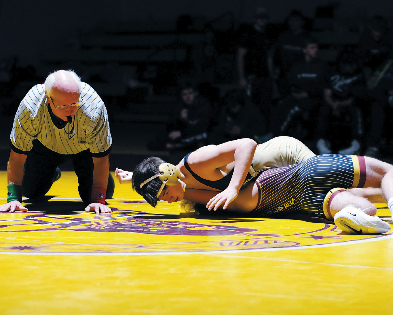 Oscar Martinez in the 139 pound weight class pins his opponent. Photo by Larry Stokke.