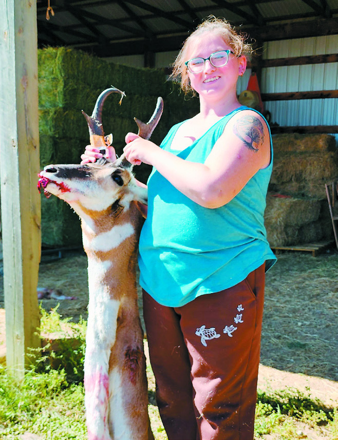 Jiry Rosecrans poses for a photo with the antelope she shot on her trip with a North Dakota non-profit called the Outdoor Adventure Foundation’s Dream Makers.