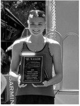 Taya Feist displays her trophy after catching the largest fish in the girls division. Submitted photo