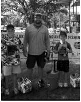 From left, Rayce Moser, Kyle Hetletved and Bryce Hetletved pose with their awards after placing in the Devils Lake Adult-Young Angler Tournament on July 11. Submitted photo