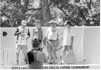 Taya, Tyler and Jake Feist are recognized during the awards ceremony at the Devils Lake Adult Young Angler Tournament on July 11. Submitted photo