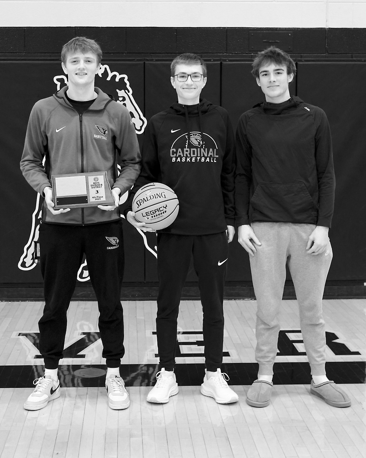 Seniors Cody Amble, Jacob Sanders and Jayden Lee pose with their 4th place finish at the District Tournament in Park Rover. Photo by Larry Stokke.