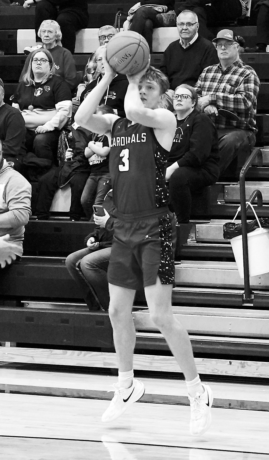 Cody Amble drains a 3-point basket at the District Tournament in Park River. Photo by Larry Stokke.