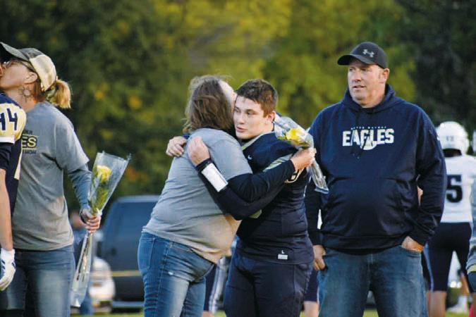 David O’Connor with his parents Chris and Amanda O’Connor. Photo by Ashley Schafer.