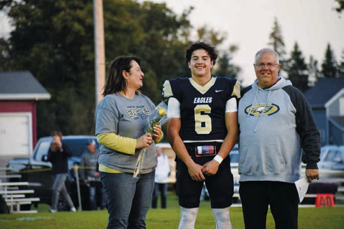 Grant Cosley with parents Shannon and Chad Cosley. Photo by Ashley Schafer.
