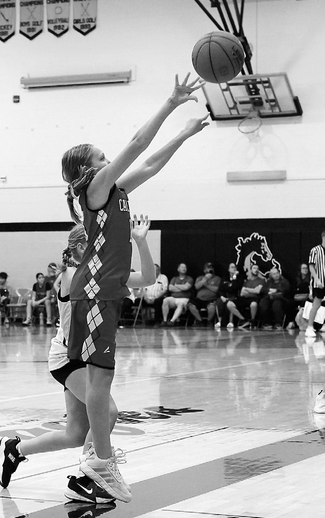 Kenastyn Pritchard drains a shot from the top of the key at the Park River Invitational. Photo by Larry Stokke.