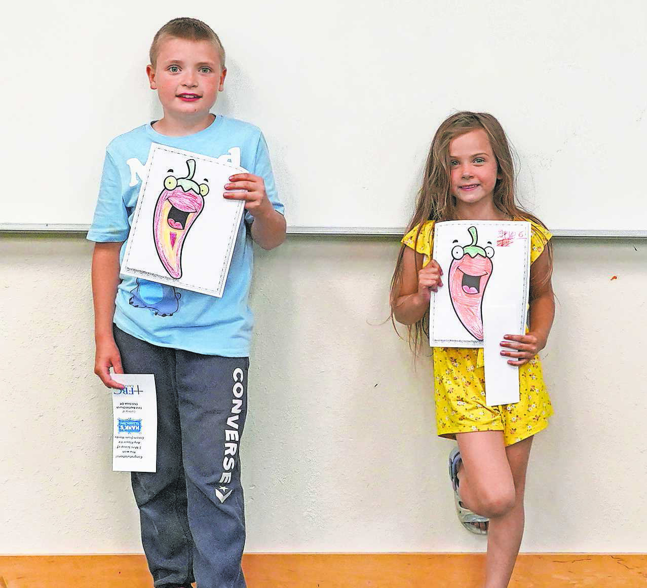 The coloring contest winners, Winston Lill, Skye Lill, and Rayelynn Christianson (not pictured.) PHOTO BY LARRY STOKKE.