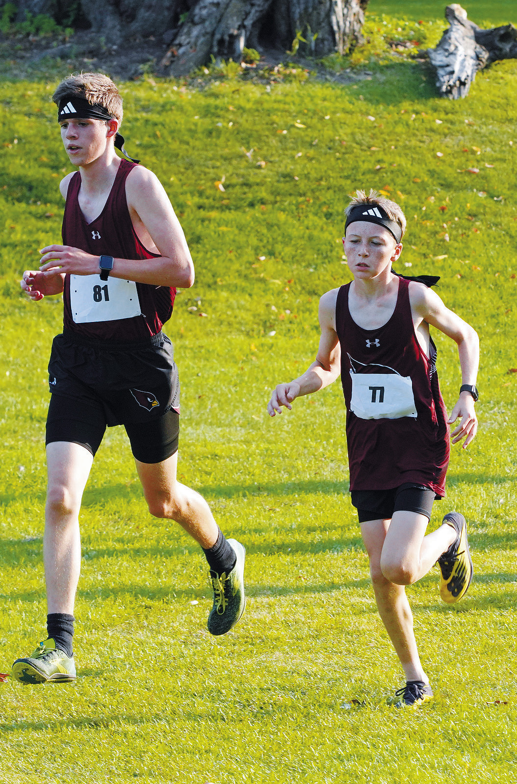 Noah Foster and Dyson Askvig run side by side at the Grafton Spoiler Cross Country Meet on Sept. 12. Photo by Larry Stokke.