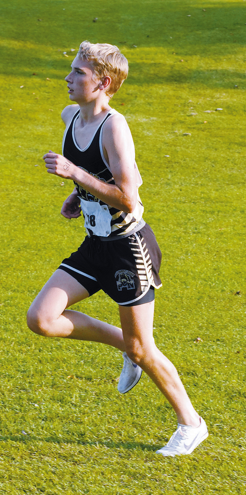 Owen Crosby finished 5th in the cross country meet in Grafton on Sept. 12. Photo by Larry Stokke.