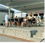 Student musicians from the Langdon Area High School Jazz Band and Pop Choir perform during the opening night of the Northern Lights Arts Council Summer Concert Series on May 28 at Boyd Block in downtown Langdon. Submitted photo