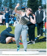 Sadie Snyder competes in the shot put at the regional meet for the PCN Grizzlies. Photo by Larry Stokke