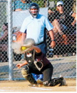 Colby Forest was a steady presence behind the plate all season for Langdon's 18U softball team. Photo by Larry Stokke