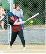 Stella Busse connects for a base hit during Langdon's game against Midway-Minto at the league tournament July 14 in Minto. Photo by Larry Stokke