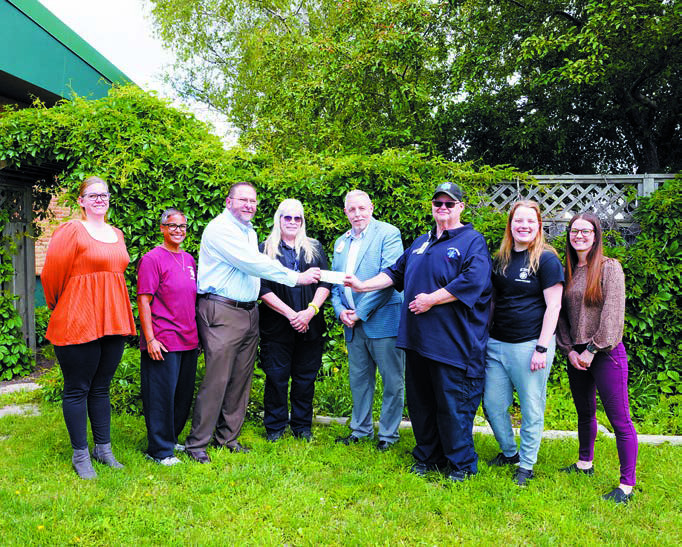 (L-R) Anna Lill, Shanda Christianson, Pastor Burton Van Kirk, Lorraine Gage, Wayne Reid (LPH CEO), Chris Sanders (Ambulance Director), Hope Thorlakson, and Jessica Tank. Photo by Larry Stokke.