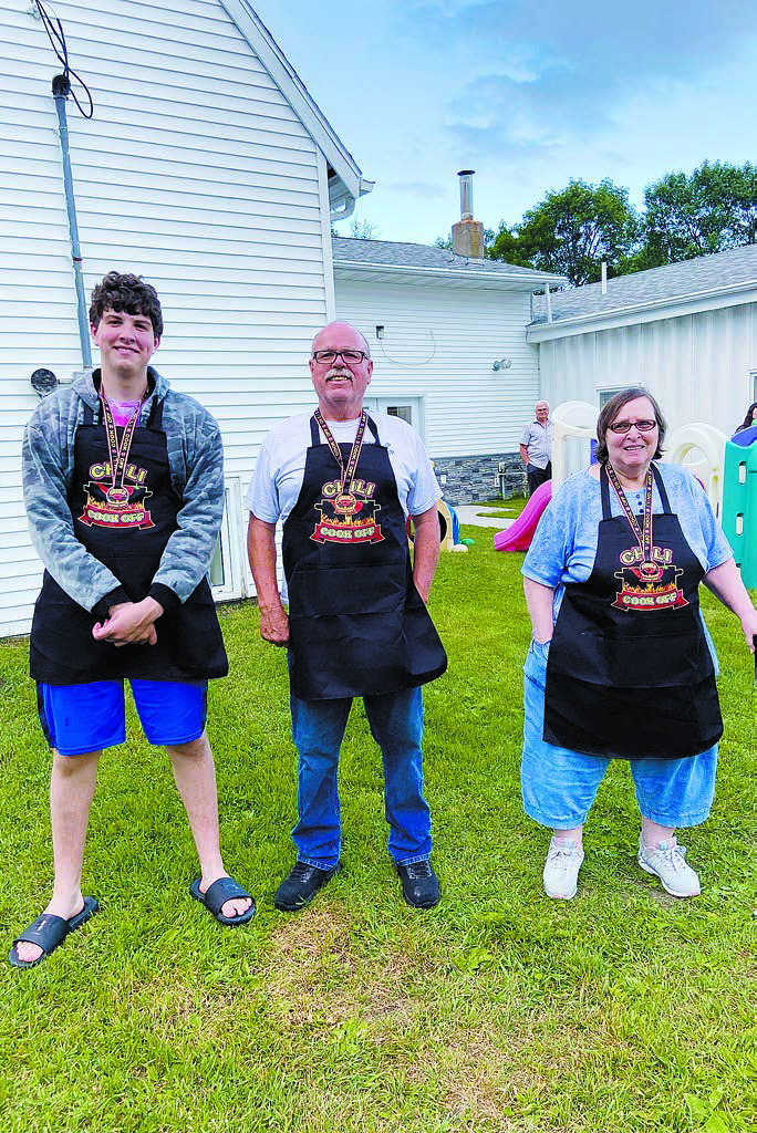 The church’s Chili Cook-Off raised $1,319 for area first responders. The total was split between the Langdon Ambulance and Cavalier County Sheriff’s Department for a total of $659.50 donated to both. Chili Cook-Off winners photographed from left to right: Jonathan Lill - Spiciest, Dennis Cornwell -Tastiest, and Patricia Wheeler - Most Interesting with her Pineapple Chili! Photo courtesy of Anna Lill