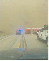 Blowing dirt created low to near-zero visibility across parts of northwest North Dakota on May 14. The first photo, provided by the North Dakota Highway Patrol, shows a crash scene in Williams County along Highway 85 near mile marker 212 during the afternoon dust storm conditions. Photo credit North Dakota Highway Patrol.