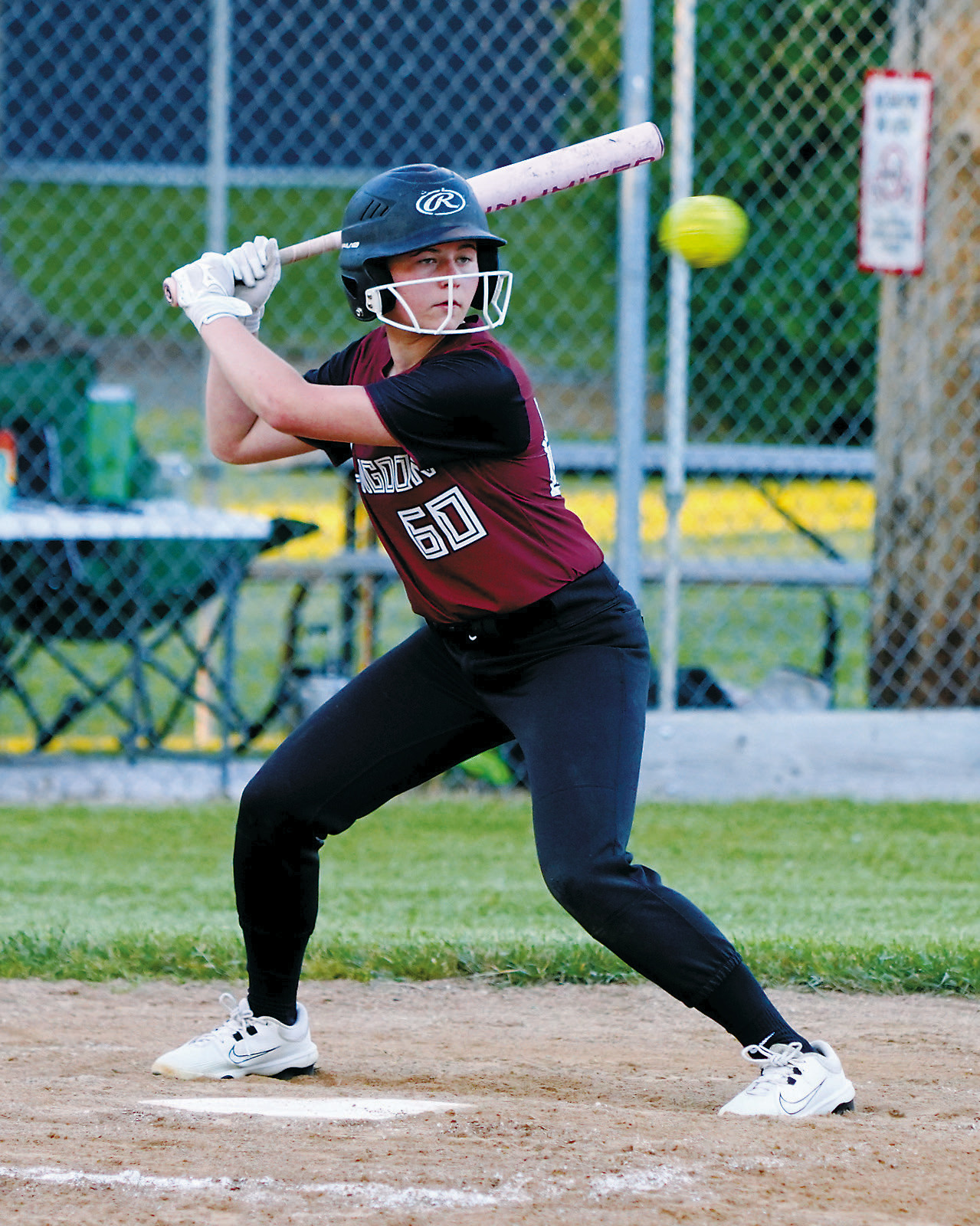 Harper Jacobson keeps her eye on the ball before driving it into the outfield for a base hit during Langdon Area/Munich's victory over Larimore on June 25 in Munich. Photo by Larry Stokke