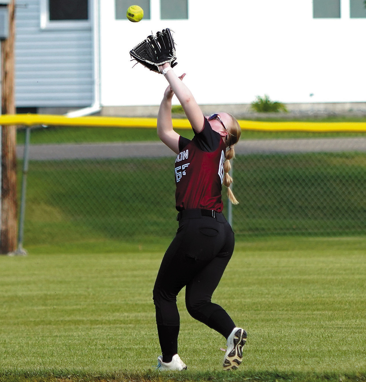 Lexi Close makes a catch in center field during Langdon Area/Munich's victory over Larimore on June 25 in Munich. Photo by Larry Stokke