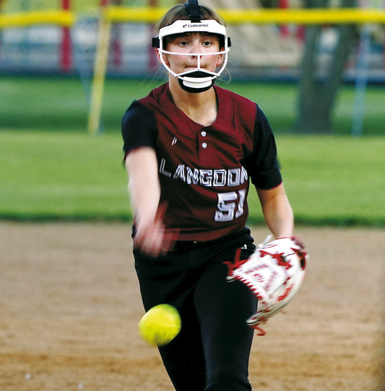 Lily Zimmer eyes the Midway/Minto batter and sends a strike to her. Photo by Larry Stokke