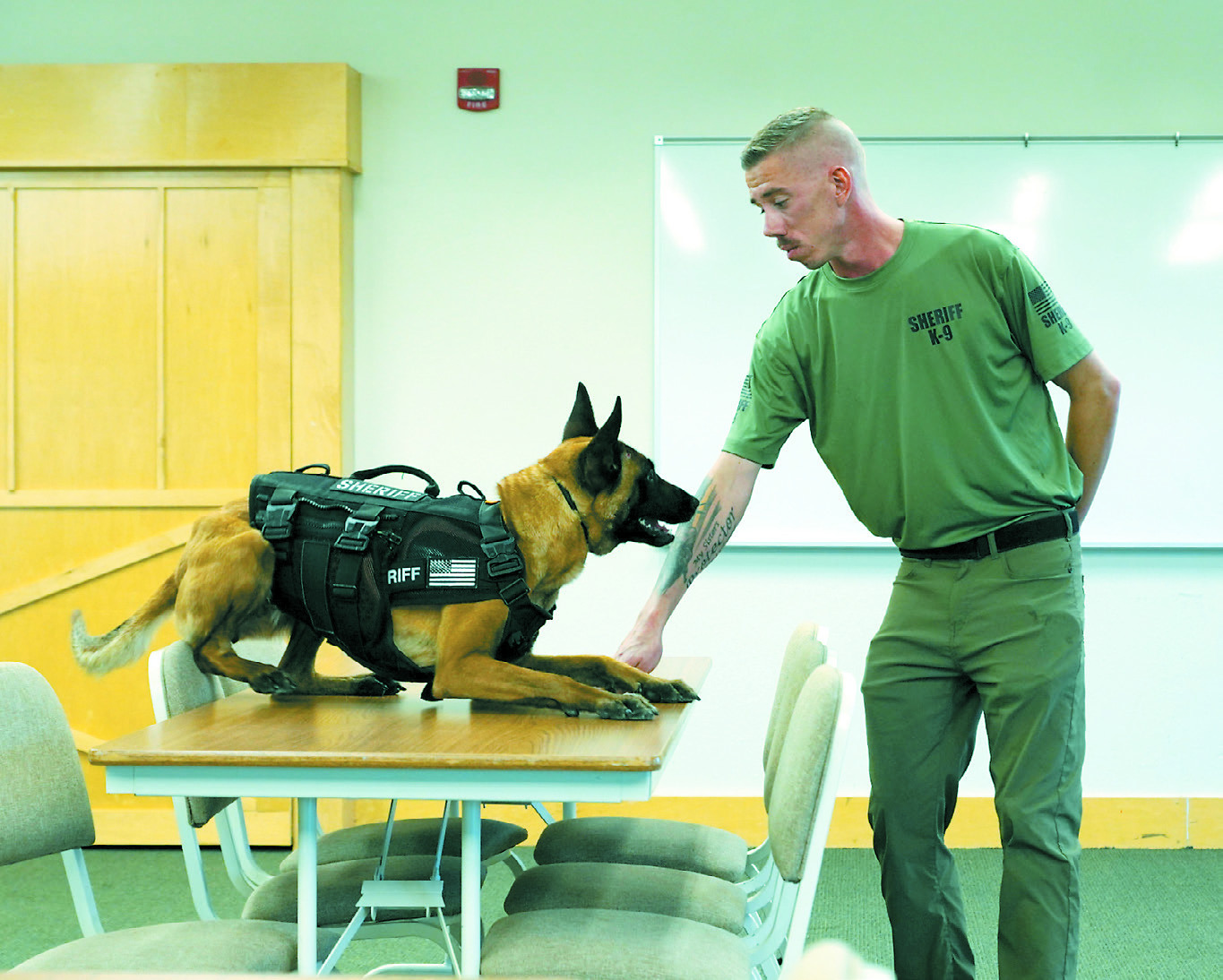 Reign and her handler, Josh Johansen, demonstrating her training capabilities at the recent K9 Meet and Greet. Photo by Larry Stokke.