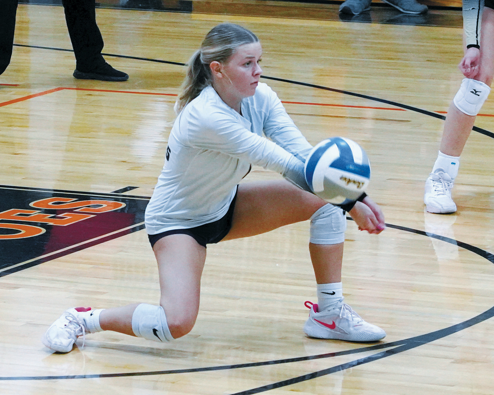 Caylee Berg had a game high of 35 digs against Cavalier. Photo by Larry Stokke.