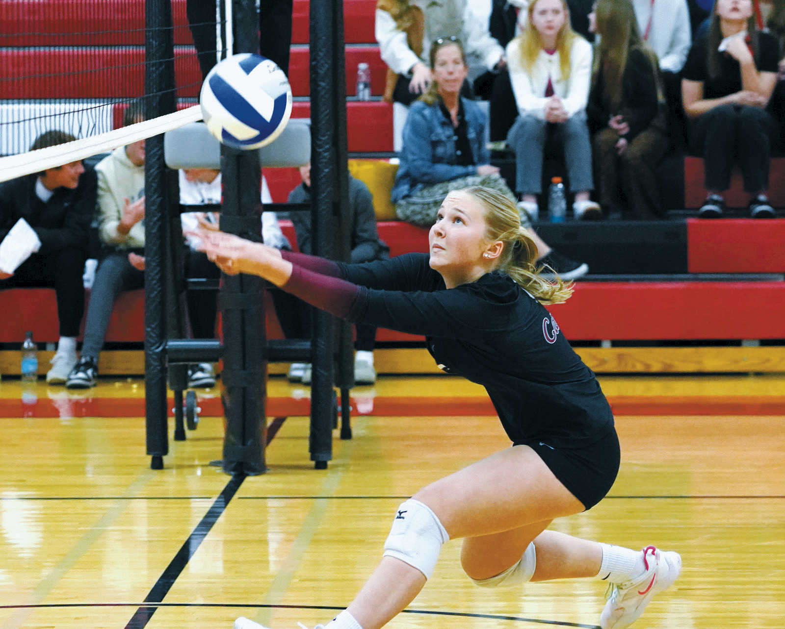 Payton Hall with a great dig at the net in the Cards win against New Rockford-Sheyenne in Devils Lake Nov. 12. Photo by Larry Stokke.