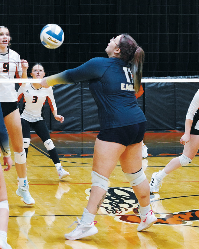 Jaelyn Forrey passes the ball to a teammate in the Eagles game against the Tornadoes. Photo by Larry Stokke.