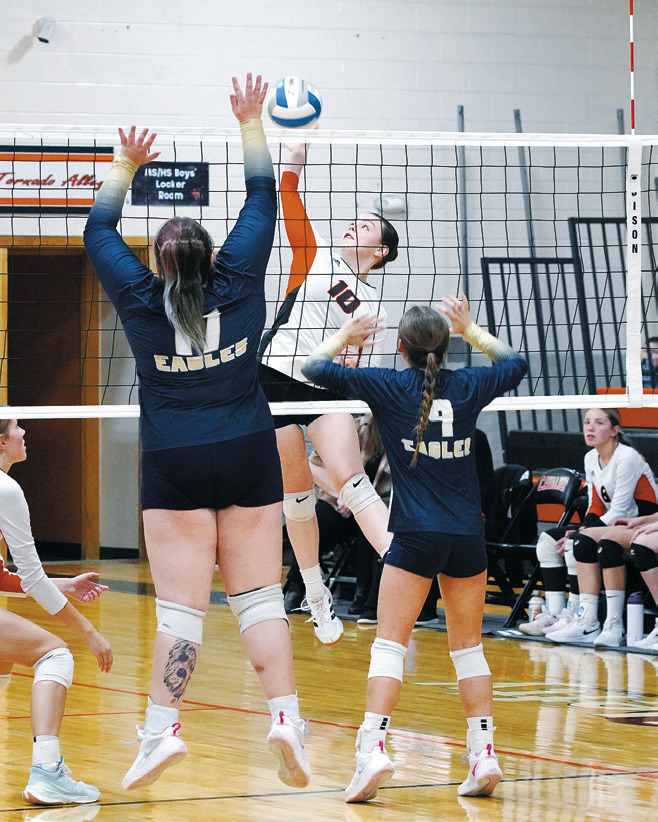 Ava Kemnetz gets a kill against the Eagles on Nov. 8 in Cavalier. Photo by Larry Stokke.