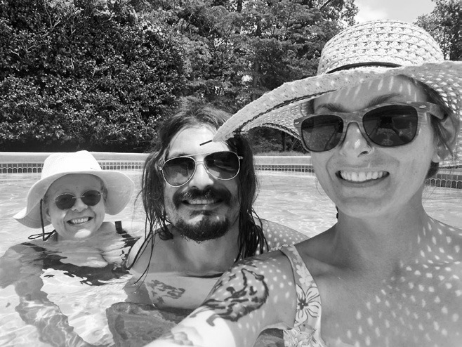 Suzanne (my mother-in-law), Phil, and I in his family’s pool trying to survive the humidity.