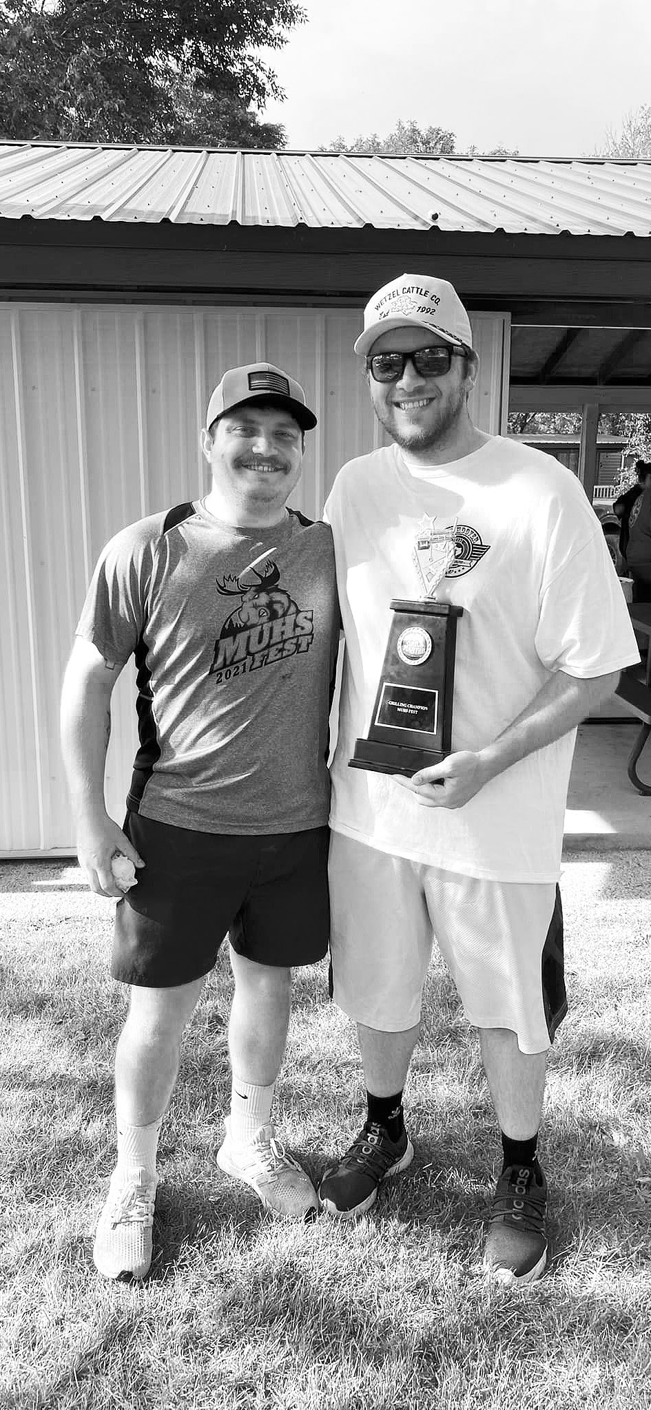Danny Muhs with Cole Darling, winner of this summer’s rib cook off.
