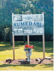 A new community sign shares photographs and history from Numedahl, which was first settled in 1888 by homesteaders from Numedal, Norway. P hoto submitted by Cory Lien