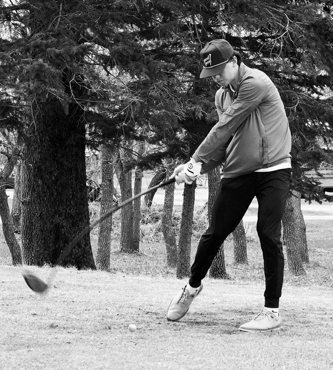 North Border's Kaden Moore tees off in McVille April 1 and finished the day in 7th place with a score of 82. Photo by Larry Stokke.