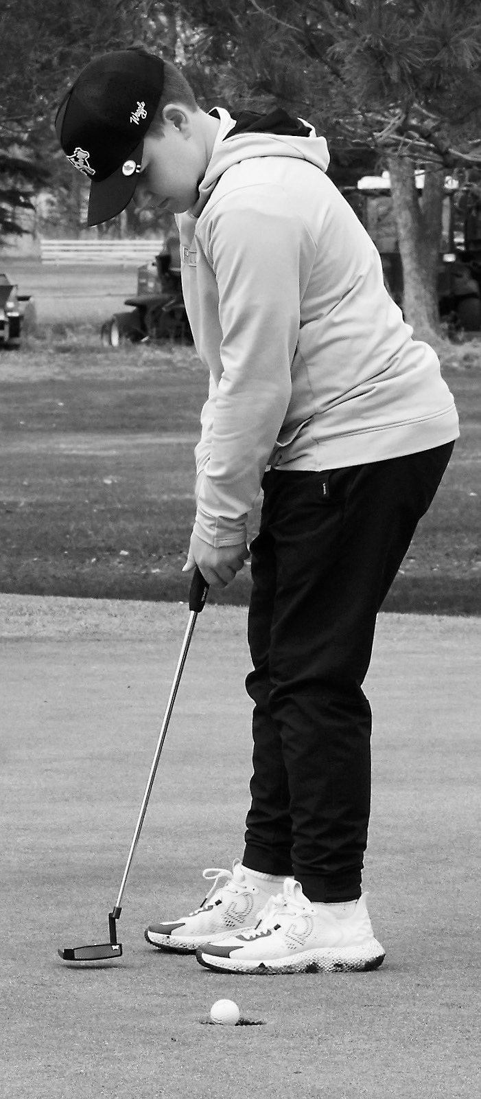 Baylor Tryan from North Border drops the ball in the cup at McVille on May 1. Photo by Larry Stokke.
